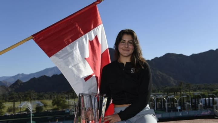 INDIAN WELLS, CA - MARCH 17: Bianca Andreescu of Canada poses with the championship trophy after her three set victory against Angelique Kerber of Germany in the women's final on day fourteen of the BNP Paribas Open at the Indian Wells Tennis Garden on March 17, 2019 in Indian Wells, California. (Photo by Kevork Djansezian/Getty Images)