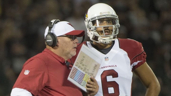 August 30, 2015; Oakland, CA, USA; Arizona Cardinals head coach Bruce Arians (left) instructs quarterback Logan Thomas (6) during the fourth quarter in a preseason NFL football game against the Oakland Raiders at O.co Coliseum. The Cardinals defeated the Raiders 30-23. Mandatory Credit: Kyle Terada-USA TODAY Sports