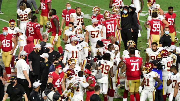 Dec 13, 2020; Glendale, Arizona, USA; The San Francisco 49ers and the Washington Football Team talk after the game at State Farm Stadium. Mandatory Credit: Matt Kartozian-USA TODAY Sports