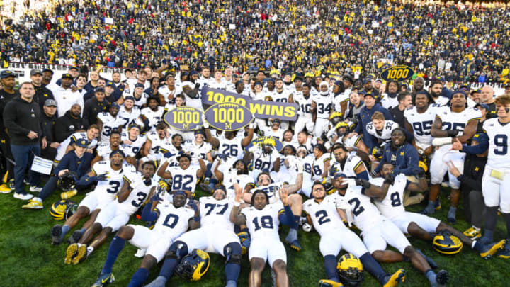 Nov 18, 2023; College Park, Maryland, USA; Michigan Wolverines celebrate the 1000th win in program history after the game against the Maryland Terrapins at SECU Stadium. Mandatory Credit: Brad Mills-USA TODAY Sports