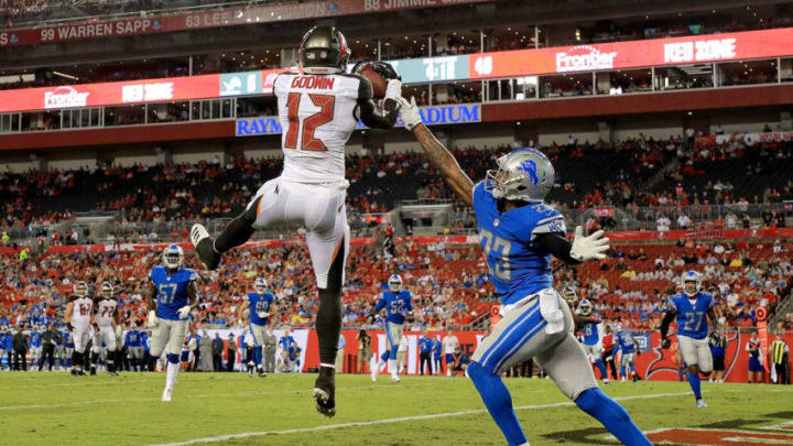 TAMPA, FL - AUGUST 24: Chris Godwin #12 of the Tampa Bay Buccaneers scores a touchdown over Darius Slay #23 of the Detroit Lions during a preseason game at Raymond James Stadium on August 24, 2018 in Tampa, Florida. (Photo by Mike Ehrmann/Getty Images)
