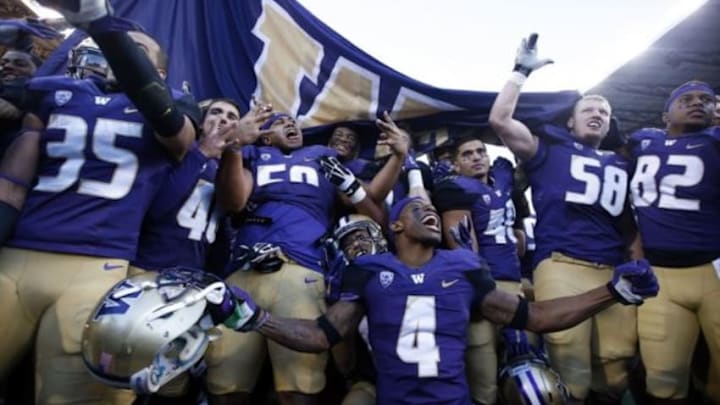 Nov 27, 2015; Seattle, WA, USA; The Washington Huskies celebrate their win over the Washington State Cougars at Husky Stadium. Washington beat Washington State 45-10. Mandatory Credit: Jennifer Buchanan-USA TODAY Sports