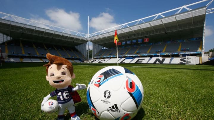 LENS, FRANCE - JUNE 09: UEFA Euro 2016 toy mascot, Super Victor and an adidas match ball at the Stade Bollaert-Delelis on June 9, 2016 in Lens, France. (Photo by Christopher Lee - UEFA/UEFA via Getty Images)