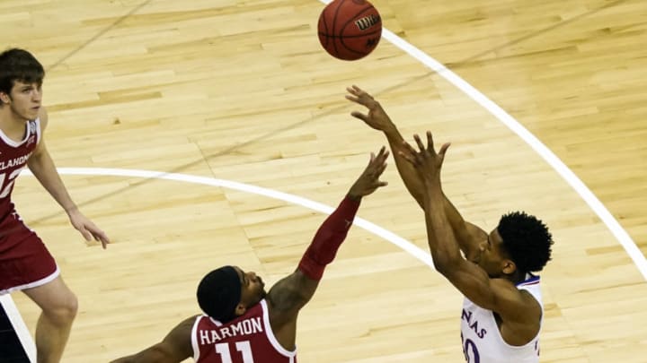 Mar 11, 2021; Kansas City, MO, USA; Kansas Jayhawks guard Ochai Agbaji (30) shoots over Oklahoma Sooners guard De'Vion Harmon (11) during the first half at T-Mobile Center. Mandatory Credit: Jay Biggerstaff-USA TODAY Sports