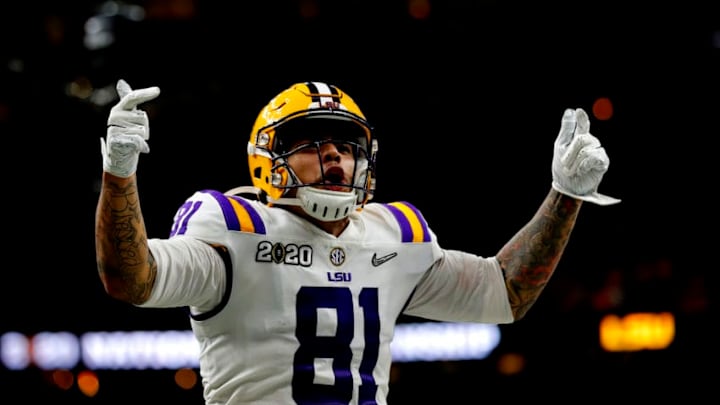 NEW ORLEANS, LOUISIANA - JANUARY 13: Thaddeus Moss #81 of the LSU Tigers reacts after scoring a touchdown against Clemson Tigers in the College Football Playoff National Championship game at Mercedes Benz Superdome on January 13, 2020 in New Orleans, Louisiana. (Photo by Jonathan Bachman/Getty Images) NEW ORLEANS, LOUISIANA - JANUARY 13: Thaddeus Moss #81 of the LSU Tigers reacts after scoring a touchdown against Clemson Tigers in the College Football Playoff National Championship game at Mercedes Benz Superdome on January 13, 2020 in New Orleans, Louisiana. (Photo by Jonathan Bachman/Getty Images)