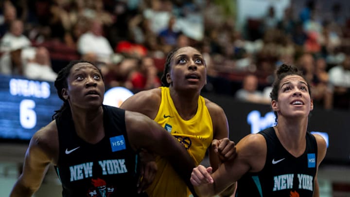 WHITE PLAINS, NY- JULY 20: Nneka Ogwumike #30 of the Los Angeles Sparks is boxed out by Tina Charles #31 and Kia Nurse #5 of the New York Liberty on July 20, 2019 at the Westchester County Center in White Plains, New York. NOTE TO USER: User expressly acknowledges and agrees that, by downloading and or using this photograph, User is consenting to the terms and conditions of the Getty Images License Agreement. Mandatory Copyright Notice: Copyright 2019 NBAE (Photo by Michelle Farsi/NBAE via Getty Images)