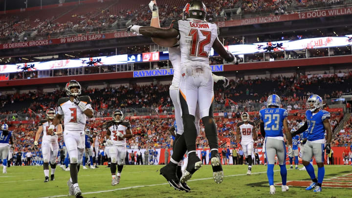 TAMPA, FL – AUGUST 24: Chris Godwin #12 and Jameis Winston #3 of the Tampa Bay Buccaneers celebrate a touchdown during a preseason game against the Detroit Lions at Raymond James Stadium on August 24, 2018, in Tampa, Florida. (Photo by Mike Ehrmann/Getty Images)