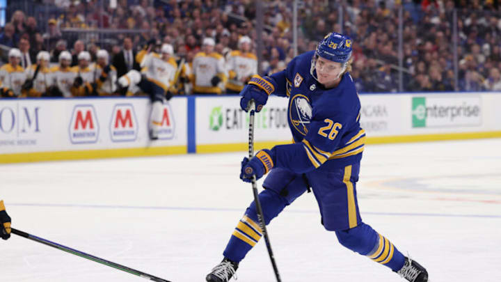 Apr 1, 2022; Buffalo, New York, USA; Buffalo Sabres defenseman Rasmus Dahlin (26) takes a shot on goal during the second period against the Nashville Predators at KeyBank Center. Mandatory Credit: Timothy T. Ludwig-USA TODAY Sports