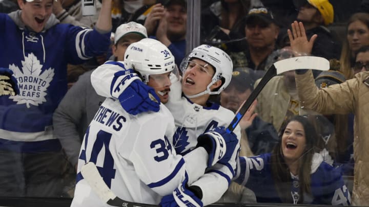 Mar 29, 2022; Boston, Massachusetts, USA; Toronto Maple Leafs center Auston Matthews (34) congratulates right wing Mitchell Marner (16) after Marner scored against the Boston Bruins during the second period at TD Garden. Mandatory Credit: Winslow Townson-USA TODAY Sports