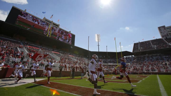 NORMAN, OK - APRIL 24: Quarterback Spencer Rattler #7 and the Oklahoma Sooners run onto the field for their spring game at Gaylord Family Oklahoma Memorial Stadium on April 24, 2021 in Norman, Oklahoma. (Photo by Brian Bahr/Getty Images)