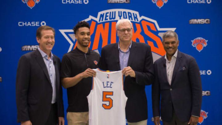 New York Knicks coach Jeff Hornacek, Knicks newest player Courtney Lee, Knicks President Phil Jackson, and General Manager Steven Mills pose at the Madison Square Garden training center, on July 8, 2016 in Tarrytown, New York. / AFP / Bryan R. Smith (Photo credit should read BRYAN R. SMITH/AFP/Getty Images)