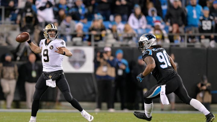 CHARLOTTE, NC – DECEMBER 17: Julius Peppers #90 of the Carolina Panthers rushes Drew Brees #9 of the New Orleans Saints in the first quarter during their game at Bank of America Stadium on December 17, 2018 in Charlotte, North Carolina. (Photo by Grant Halverson/Getty Images)