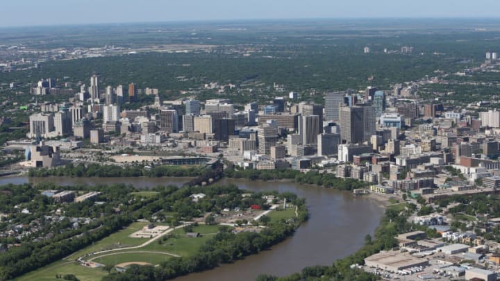 WINNIPEG, MB - JUNE 15: An aerial view of the Winnipeg skyline by the Red River on June 15, 2013 in Winnipeg, Manitoba. (Photo by Tom Szczerbowski/Getty Images)