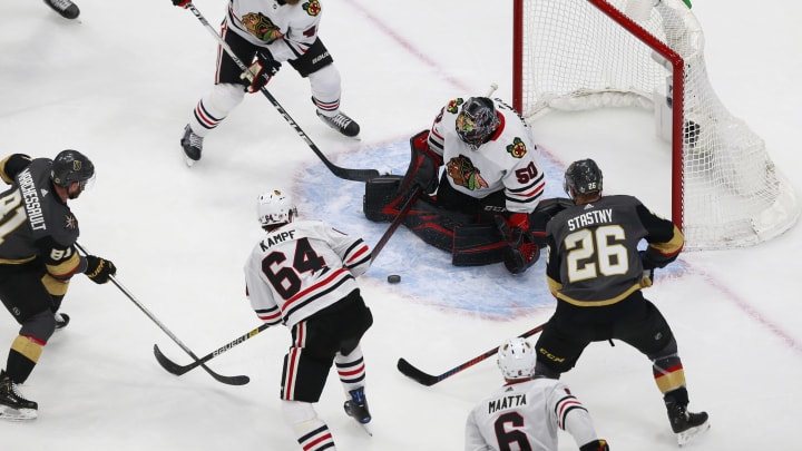 Corey Crawford #50 of the Chicago Blackhawks blocks a shot against the Vegas Golden Knights during the second period in Game One of the Western Conference First Round.