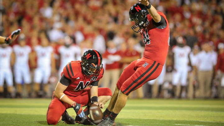 LINCOLN, NE - SEPTEMBER 29: Kicker Brett Maher #96 kicks the ball held by cornerback Jase Dean #31 of the Nebraska Cornhuskers during their game against the Wisconsin Badgers at Memorial Stadium on September 29, 2012 in Lincoln, Nebraska. (Photo by Eric Francis/Getty Images)