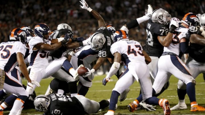 Nov 6, 2016; Oakland, CA, USA; Oakland Raiders running back Latavius Murray (28) scores a touchdown against the Denver Broncos in the second quarter at Oakland Coliseum. Mandatory Credit: Cary Edmondson-USA TODAY Sports