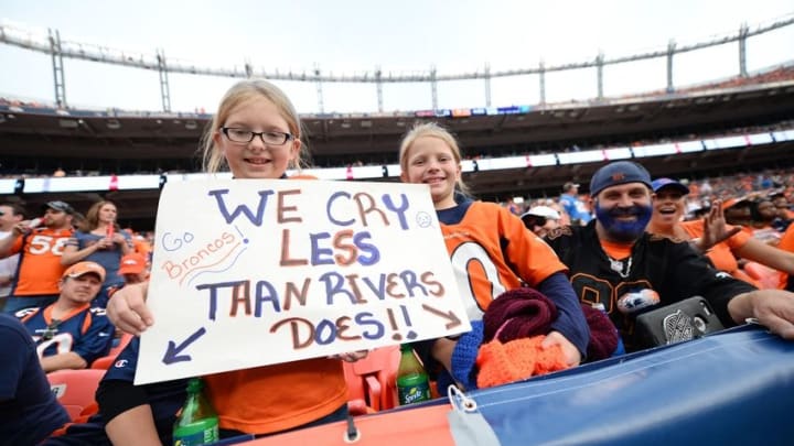 Oct 30, 2016; Denver, CO, USA; Denver Broncos fans hold a sign in reference to San Diego Chargers quarterback Philip Rivers (17) (not pictured) in the second half at Sports Authority Field at Mile High. Mandatory Credit: Ron Chenoy-USA TODAY Sports