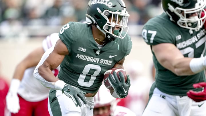 EAST LANSING, MICHIGAN – OCTOBER 15: Jalen Berger #8 of the Michigan State Spartans runs the ball against the Wisconsin Badgers at Spartan Stadium on October 15, 2022 in East Lansing, Michigan. (Photo by Nic Antaya/Getty Images)