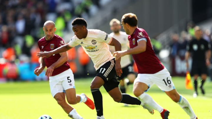 LONDON, ENGLAND - SEPTEMBER 29: Anthony Martial of Manchester United is tackled by Pablo Zabaleta (l) and Mark Noble of West Ham United (r) during the Premier League match between West Ham United and Manchester United at London Stadium on September 29, 2018 in London, United Kingdom. (Photo by Warren Little/Getty Images)