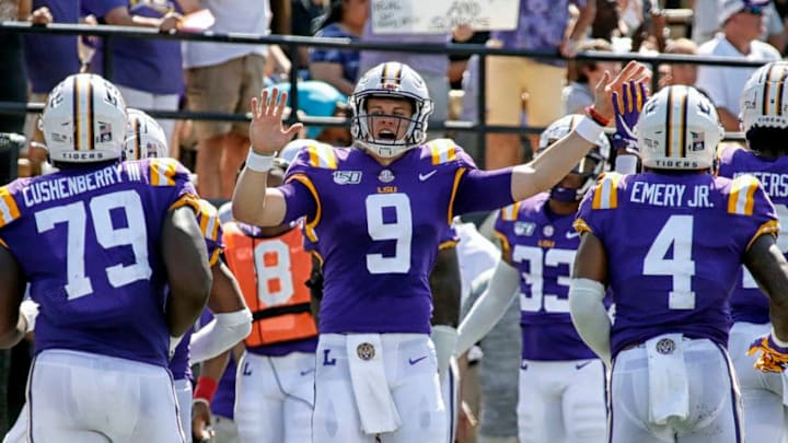 NASHVILLE, TENNESSEE - SEPTEMBER 21: Quarterback Joe Burrow #9 of the LSU Tigers high fives teammates after scoring against the Vanderbilt Commodores during the first half at Vanderbilt Stadium on September 21, 2019 in Nashville, Tennessee. (Photo by Frederick Breedon/Getty Images)