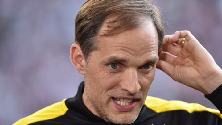 Dortmund’s head coach Thomas Tuchel reacts during an interview prior to the German first division Bundesliga football match between FC Augsburg and Borussia Dortmund on May 13, 2017 in Augsburg, southern Germany. / AFP PHOTO / Christof STACHE / RESTRICTIONS: DURING MATCH TIME: DFL RULES TO LIMIT THE ONLINE USAGE TO 15 PICTURES PER MATCH AND FORBID IMAGE SEQUENCES TO SIMULATE VIDEO. == RESTRICTED TO EDITORIAL USE == FOR FURTHER QUERIES PLEASE CONTACT DFL DIRECTLY AT 49 69 650050(Photo credit should read CHRISTOF STACHE/AFP/Getty Images)
