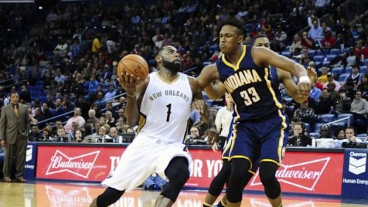 Jan 8, 2016; New Orleans, LA, USA; New Orleans Pelicans guard Tyreke Evans (1) drives down the court as he is defended by Indiana Pacers forward Myles Turner (33) during the first quarter of the game at the Smoothie King Center. Mandatory Credit: Matt Bush-USA TODAY Sports