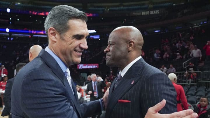 NEW YORK, NY - JANUARY 28: Head coach Jay Wright of the Villanova Wildcats, left, greets head coach Mike Anderson of the St. John's basketball team before their game at Madison Square Garden on January 28, 2020 in New York City. (Photo by Porter Binks/Getty Images)