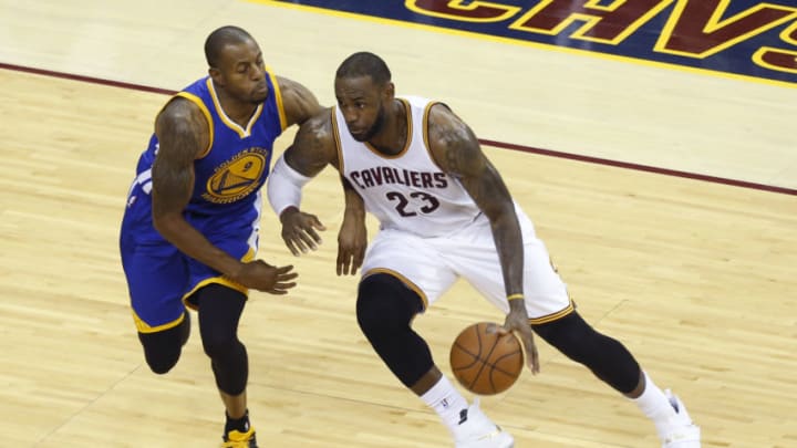 Cleveland Cavaliers forward LeBron James (R) looks for an opening against Golden State Warriors guard Andre Iguodala (L) during Game 6 of the NBA Finals in Cleveland, Ohio on June 16, 2016. / AFP / Jay LaPrete (Photo credit should read JAY LAPRETE/AFP via Getty Images)