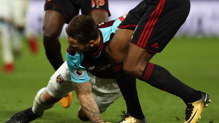 WATFORD, ENGLAND - NOVEMBER 19: Marko Arnautovic of West Ham United is injured after Marvin Zeegelaar of Watford stands on his hand during the Premier League match between Watford and West Ham United at Vicarage Road on November 19, 2017 in Watford, England. (Photo by Catherine Ivill/Getty Images)