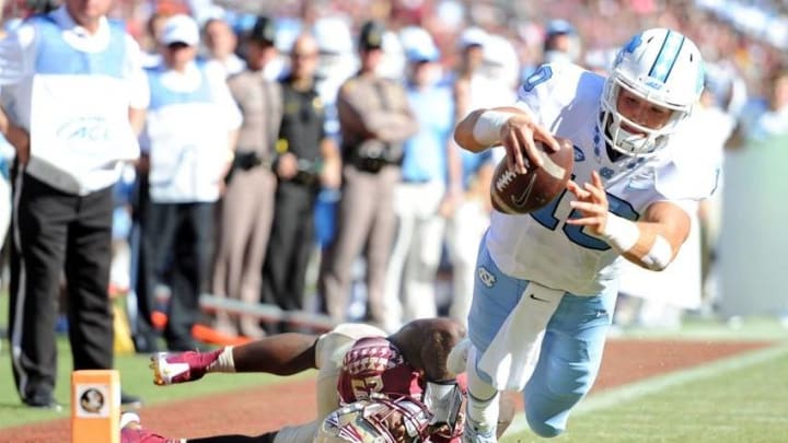 Oct 1, 2016; Tallahassee, FL, USA; Florida State Seminoles defensive back Nate Andrews (29) cannot bring down North Carolina Tarheels quarterback Mitch Trubisky (10) as he scores a touchdown at Doak Campbell Stadium. Mandatory Credit: Melina Vastola-USA TODAY Sports