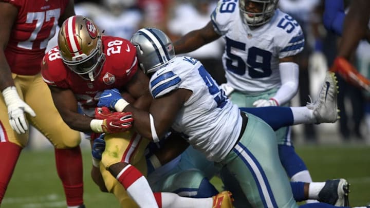 SANTA CLARA, CA - OCTOBER 02: Carlos Hyde #28 of the San Francisco 49ers is tackled by Terrell McClain #97 of the Dallas Cowboys during the third quarter at Levi's Stadium on October 2, 2016 in Santa Clara, California. (Photo by Thearon W. Henderson/Getty Images)