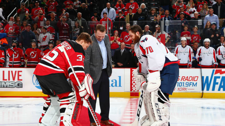 NEWARK, NJ – FEBRUARY 06: Former New Jersey Devil Martin Brodeur drops the ceremonial first puck between Cory Schneider #35 of the New Jersey Devils and Braden Holtby #70 of the Washington Capitals prior to the game at the Prudential Center on February 6, 2016 in Newark, New Jersey. (Photo by Andy Marlin/NHLI via Getty Images)