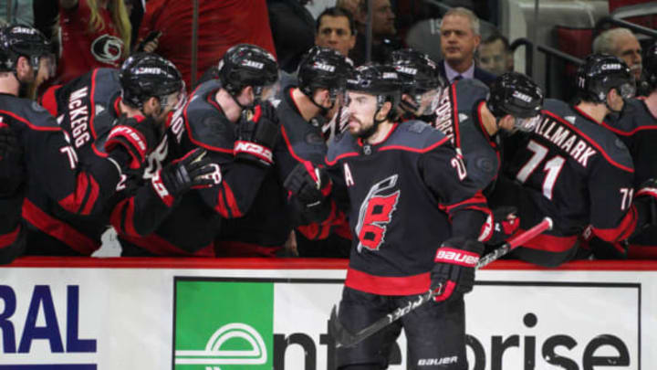 RALEIGH, NC – MAY 01: Carolina Hurricanes defenseman Justin Faulk (27) celebrates with teammates after scoring in the second period during a game between the Carolina Hurricanes and the New York Islanders on May 1, 2019 at the PNC Arena in Raleigh, NC. (Photo by Greg Thompson/Icon Sportswire via Getty Images)