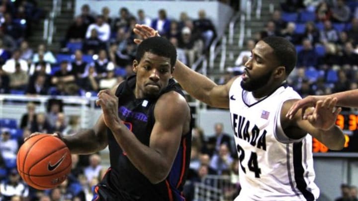 Jan 14, 2014; Reno, NV, USA; Boise State Broncos guard Derrick Marks (2) drives the ball in front of Nevada Wolf Pack guard Deonte Burton (24) in the second half of their NCAA basketball game at Lawlor Events Center. Mandatory Credit: Lance Iversen-USA TODAY Sports.