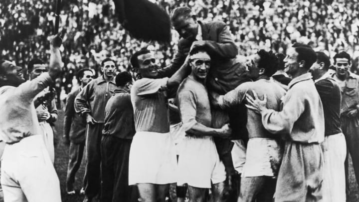 10th June 1934: The Italian World Cup squad carry their manager, Vittorio Pozzo (1886 – 1968), shoulder high following their 2-1 victory over Czechoslovakia after extra time in the World Cup final in Rome. (Photo by Keystone/Getty Images)