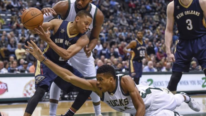 Nov 10, 2016; Milwaukee, WI, USA; Milwaukee Bucks forward Giannis Antetokounmpo (34) tries to steal the ball from New Orleans Pelicans guard Tim Frazier (2) in the fourth quarter at BMO Harris Bradley Center. The Pelicans beat the Bucks 112-106. Mandatory Credit: Benny Sieu-USA TODAY Sports