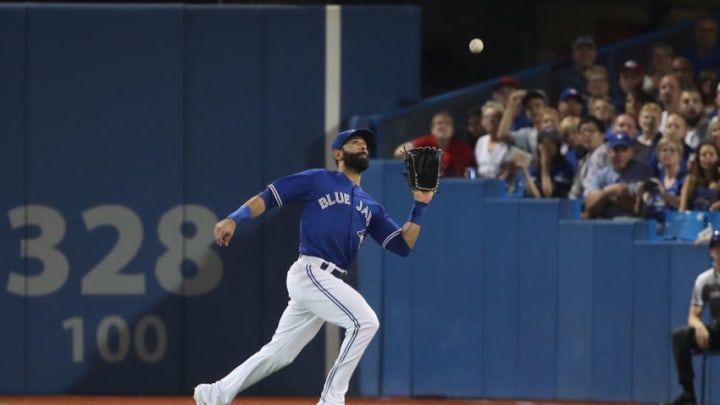 TORONTO, ON - SEPTEMBER 22: Jose Bautista #19 of the Toronto Blue Jays makes a running catch in the fourth inning during MLB game action against the New York Yankees at Rogers Centre on September 22, 2017 in Toronto, Canada. (Photo by Tom Szczerbowski/Getty Images)