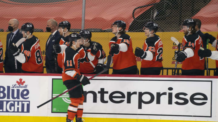 Apr 10, 2021; Philadelphia, Pennsylvania, USA; Philadelphia Flyers right wing Travis Konecny (11) celebrates with teammates after scoring a goal against the Boston Bruins in the first period at the Wells Fargo Center. Mandatory Credit: Mitchell Leff-USA TODAY Sports