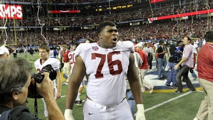 Dec 1, 2012; Atlanta, GA, USA; Alabama Crimson Tide offensive linesman D.J. Fluker (76) celebrates winning the 2012 SEC Championship game against the Georgia Bulldogs at the Georgia Dome. Alabama won 32-28. Mandatory Credit: Daniel Shirey-USA TODAY Sports