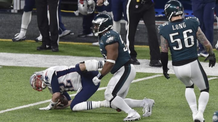 MINNEAPOLIS, MN - FEBRUARY 04: Tom Brady #12 of the New England Patriots gets tackled by Brandon Graham #55 of the Philadelphia Eagles during Super Bowl LII at U.S. Bank Stadium on February 4, 2018 in Minneapolis, Minnesota. The Eagles defeated the Patriots 41-33. (Photo by Focus on Sport/Getty Images) *** Local Caption *** Tom Brady; Brandon Graham