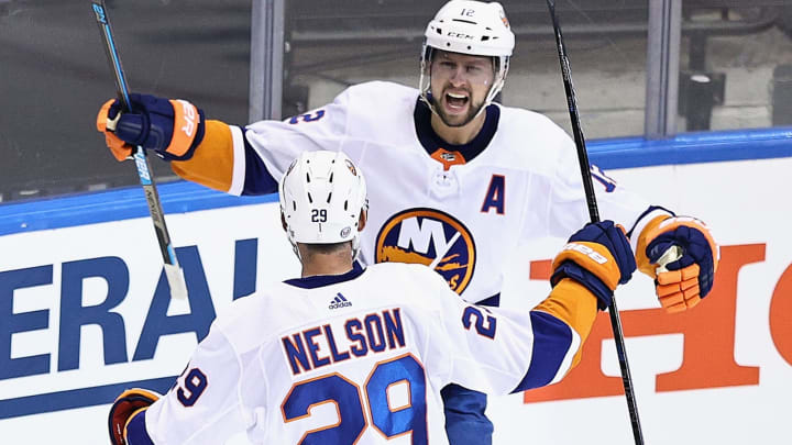 TORONTO, ONTARIO – AUGUST 12: Josh Bailey #12 of the New York Islanders celebrates his short-handed goal at 6:52 of the third period against the Washington Capitals and is joined by Brock Nelson #29 in Game One of the Eastern Conference First Round during the 2020 NHL Stanley Cup Playoffs at Scotiabank Arena on August 12, 2020 in Toronto, Ontario, Canada. (Photo by Elsa/Getty Images)