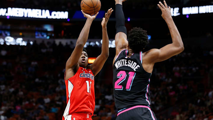 MIAMI, FL – JANUARY 04: Thomas Bryant #13 of the Washington Wizards shoots over Hassan Whiteside #21 of the Miami Heat at American Airlines Arena on January 4, 2019 in Miami, Florida. NOTE TO USER: User expressly acknowledges and agrees that, by downloading and or using this photograph, User is consenting to the terms and conditions of the Getty Images License Agreement. (Photo by Michael Reaves/Getty Images)