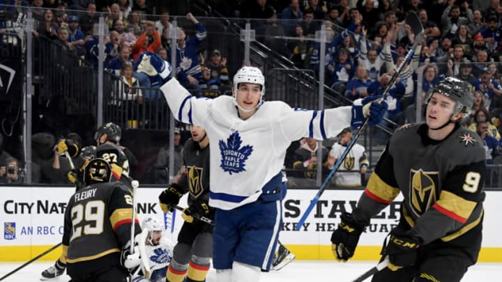 LAS VEGAS, NEVADA - NOVEMBER 19: Cody Glass #9 of the Vegas Golden Knights reacts as Ilya Mikheyev #65 of the Toronto Maple Leafs celebrates a third-period power-play goal by his teammate Zach Hyman #11 (not pictured) during their game at T-Mobile Arena on November 19, 2019 in Las Vegas, Nevada. The Golden Knights defeated the Leafs 4-2. (Photo by Ethan Miller/Getty Images)