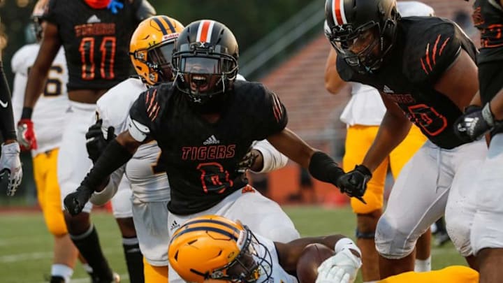 Belleville defensive back Myles Rowser (8) celebrates a tackle Syndication: Detroit Free Press