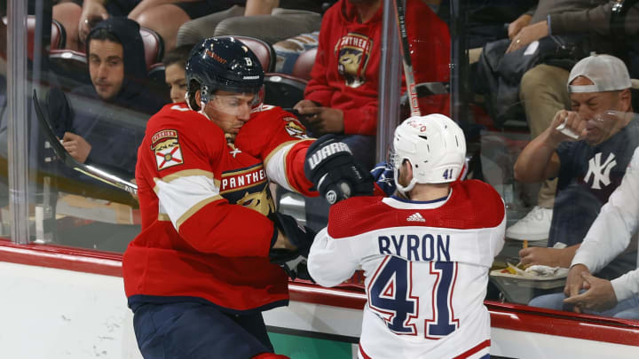 SUNRISE, FL – MARCH 29: Ben Chiarot #8 of the Florida Panthers and Paul Byron #41 of the Montreal Canadiens battle behind the net during first-period action at the FLA Live Arena on March 29, 2022 in Sunrise, Florida. (Photo by Joel Auerbach/Getty Images)