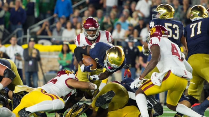 SOUTH BEND, IN - OCTOBER 21: Notre Dame Fighting Irish running back Josh Adams (33) dives in for a 3 yard touchdown during the college football game between the Notre Dame Fighting Irish and USC Trojans on October 21, 2017, at Notre Dame Stadium in South Bend, IN. (Photo by Zach Bolinger/Icon Sportswire via Getty Images)