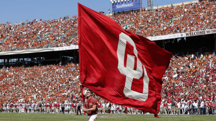 Oct 10, 2015; Dallas, TX, USA; Oklahoma Sooners ruf-nek carries an Oklahoma flag after a score against the Texas Longhorns during Red River rivalry at Cotton Bowl Stadium. Mandatory Credit: Matthew Emmons-USA TODAY Sports