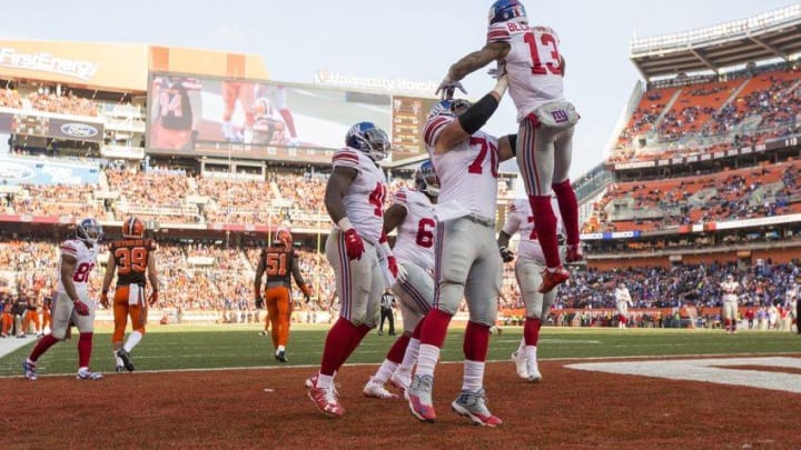 Nov 27, 2016; Cleveland, OH, USA; New York Giants wide receiver Odell Beckham (13) celebrates his touchdown with teammates against the Cleveland Browns during the second quarter at FirstEnergy Stadium. Mandatory Credit: Scott R. Galvin-USA TODAY Sports