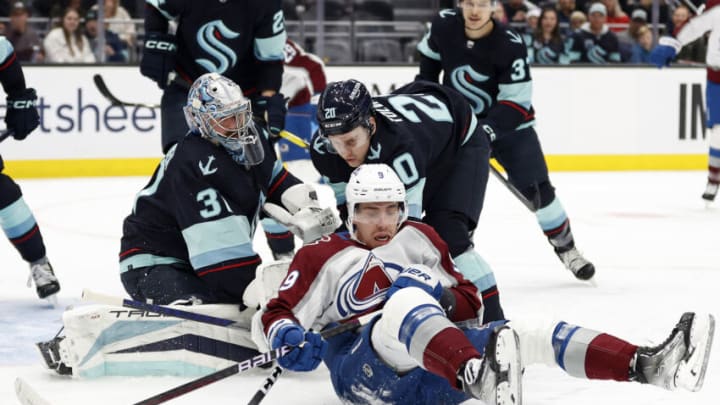 SEATTLE, WASHINGTON - JANUARY 21: Evan Rodrigues #9 of the Colorado Avalanche looks to play the puck against the Seattle Kraken during the first period at Climate Pledge Arena on January 21, 2023 in Seattle, Washington. (Photo by Steph Chambers/Getty Images)