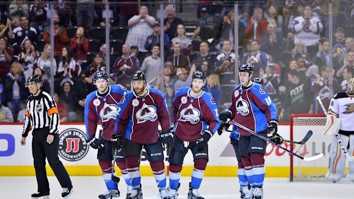 Apr 9, 2016; Denver, CO, USA; Colorado Avalanche defenseman Zach Redmond (22) following his goal skates back to center ice with defenseman Erik Johnson (6) and center Mikhail Grigorenko (25) and center Shawn Matthias (18) in the third period against the Anaheim Ducks at Pepsi Center. The Ducks defeated the Avalanche 5-3. Mandatory Credit: Ron Chenoy-USA TODAY Sports